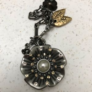 Coach tea rose purse charm.